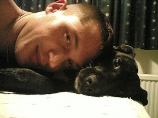 Guy Whispering In Dogs Ear Guy Whispering In Dogs Ear