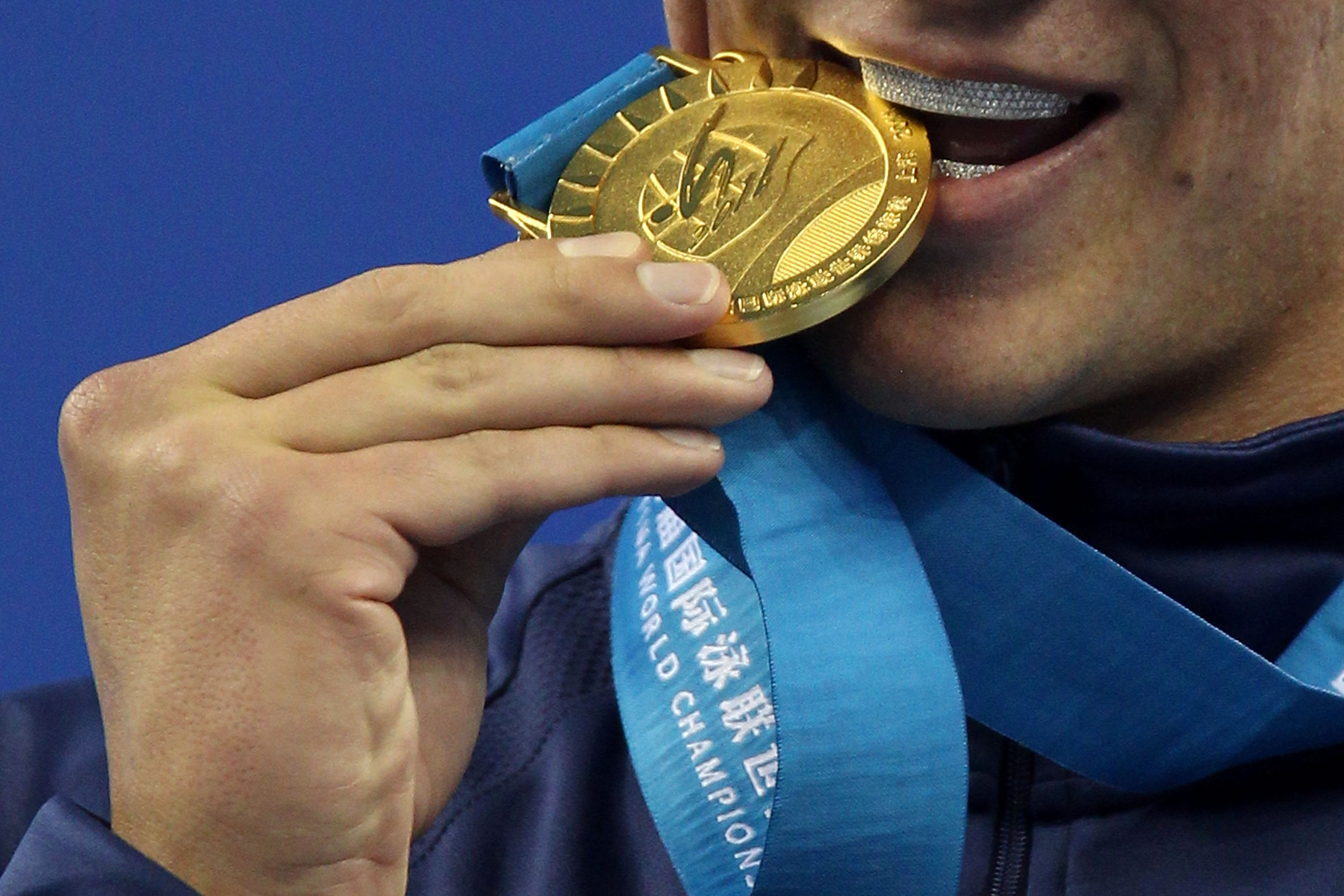Why Do Olympians Bite Their Medals The Answer Is Much Less Bizarre