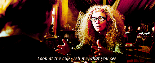 A GIF from the movie, 'Harry Potter and the Prisoner of Azkaban'. Professor Trelawney is encouraging Ron to read his tea leaves.